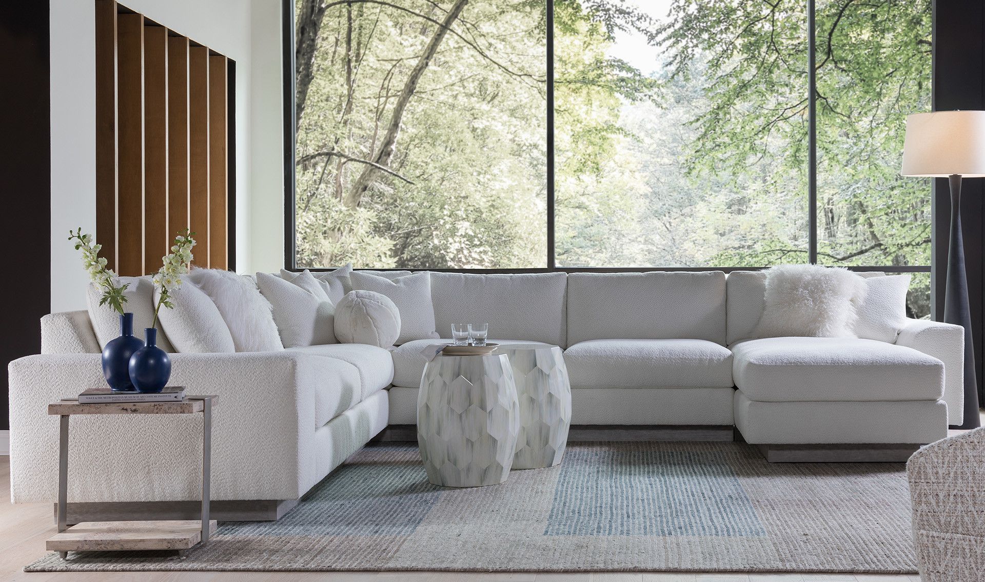 Artistica Upholstery scene featuring a sectional, console, and two side tables.